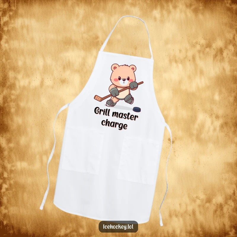 Funny apron: A determined bear charges forward with a hockey stick and puck, ready to cook up a storm.