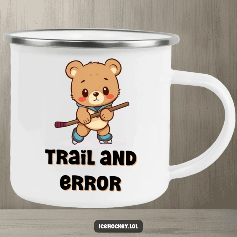 Funny camping mug featuring a curious bear cub awkwardly skating with a comically large hockey stick, for outdoor fun.