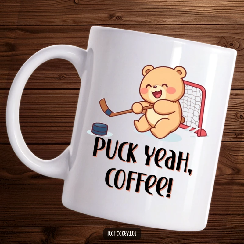 Funny mug depicting a joyful, round bear cub skillfully shooting a hockey puck towards a net, embodying energetic sports fun.