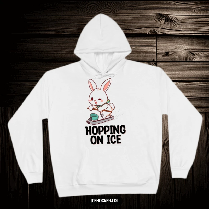 Funny hoodie depicting a smiling, determined bunny gliding fast on ice, puck in tow, embodying a passionate hockey player.