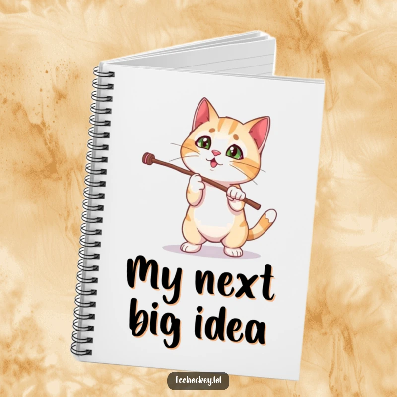 Funny cat notebook cover showing a curious kitten comically failing at a magic stick trick, inspiring note-taking with humor.
